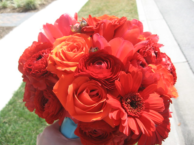 Red roses red gerbera daisies and red ranunculus bridal bouquet