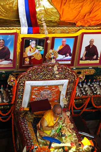 Bodhisattva Day, His Holiness Jigdal Dagchen Sakya on his throne from above, bell and dorje, photo of His Holiness the Great 14th Dalai Lama, offerings, flower decorations, shrine, Lamdre, Tharlam Monastery of Tibetan Buddhism, Boudha, Kathmandu, Nepal by Wonderlane