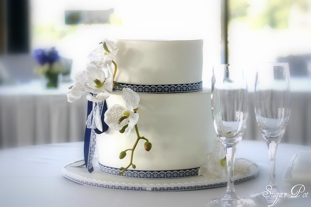 2 tier Navy blue and Orchids wedding cake Base 9 inch double barrel red 