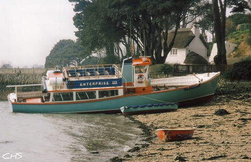 An unusual photo of Enterprise III beached at Flushing, Penryn River - 1996 by Stocker Images