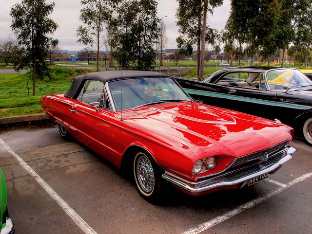 1966 Ford Thunderbird A very nice red 66 Tbird parked alongside it is a 