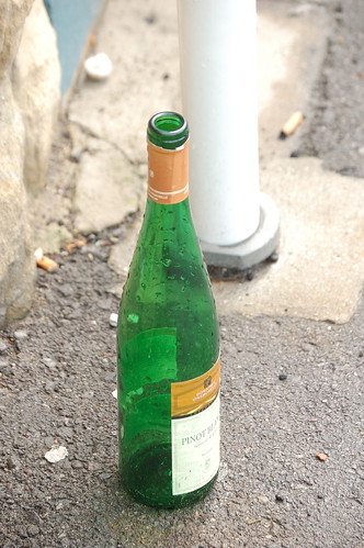 Empty bottle on the sidewalk