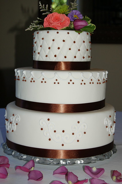 White Brown wedding cake with scroll and quilt design by Sweet Cakes of