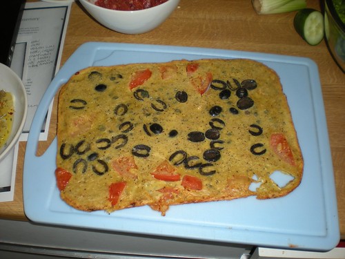 Chickpea pancake with olives, tomatoes and capers