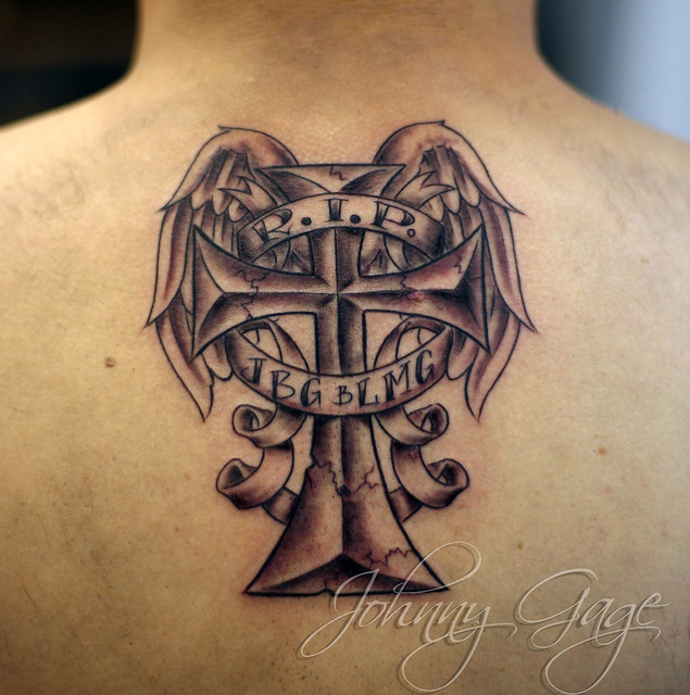 RIP cross with wings tattoo Tattooed by Johnny at The Tattoo Studio