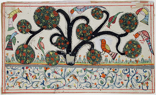 Birds in a tree with balls of vegetation