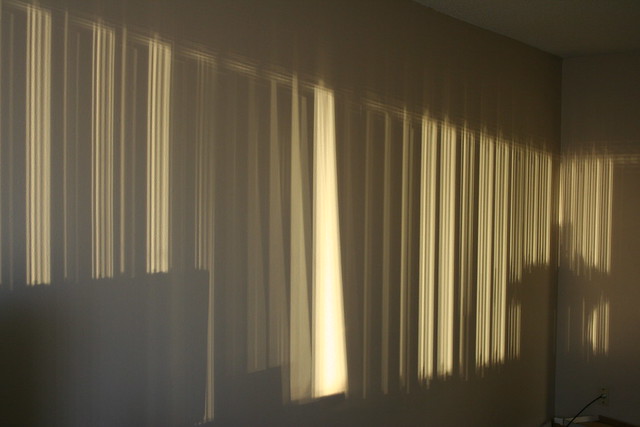 setting sun and vertical blinds