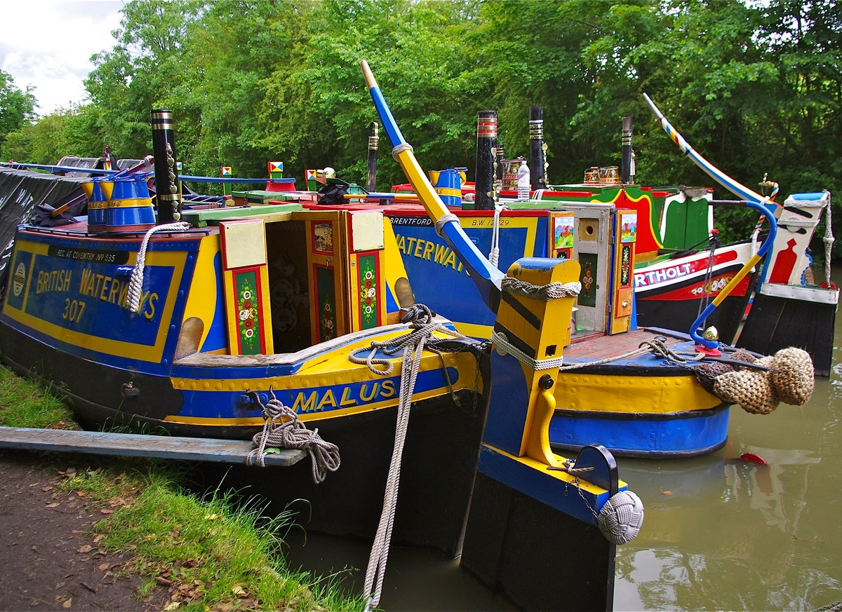 Brightly coloured historic narrowboats at Braunston, Northamptonshire. Credit David Merrett