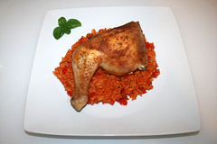 Chicken leg on tomato rice / Hähnchenschenkel auf Tomatenreis