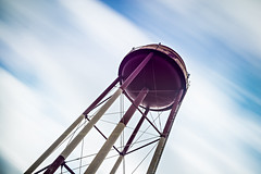 long exposure sky and clouds with water tower