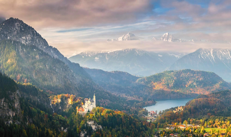 Neuschwanstein Castle and Lake Alpsee in the Bavarian Alps. Credit Dmytro Balkhovitin