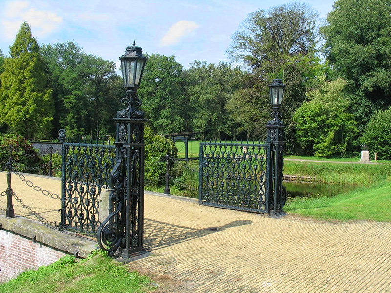 Ornamental ironwork gates to bridge over the moat around Doorn House. Credit Basvb
