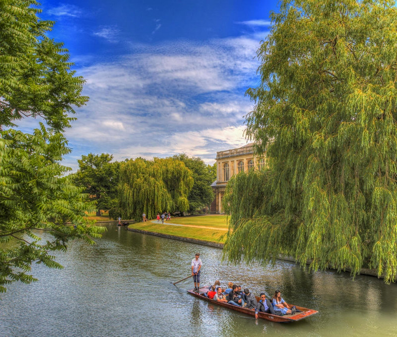 Punting past Trinity College Wren Library. Credit Scudamore’s Punting Cambridge, flickr