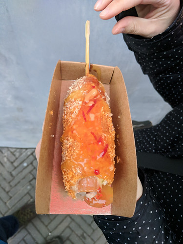 hot dog battered, fried, coated in breadcrumbs and drizzled with sweet chili sauce. OMG.