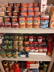Cans of food arranged  on shelves, soup, beans, West Olympia, Washington, USA