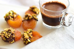 Chocolate-dipped dried apricots, sprinkled with pistachios. Accompanying my Turkish coffee.