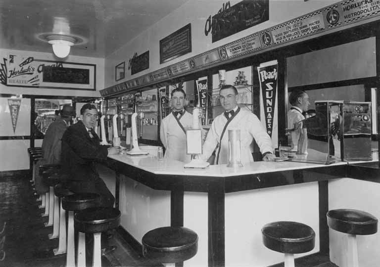 Customers seated at an unidentified ice cream and soda fountain, Seattle