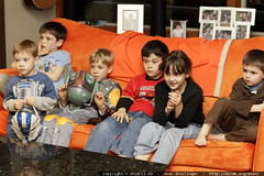 kids watching a movie at the party 