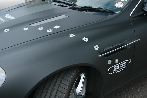 Fake bullet holes on matte black Aston
