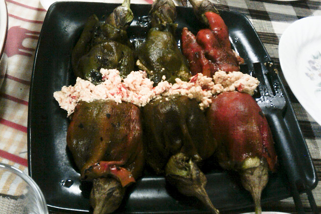 Roasted Bell Peppers stuffed with roasted eggplant and sauteed mushrooms topped with spicy crumbled feta cheese