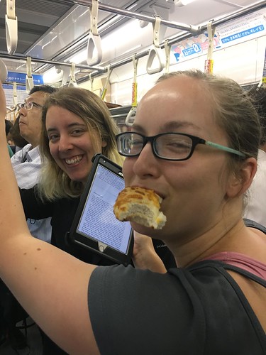Sneaking a bite on a Tokyo train