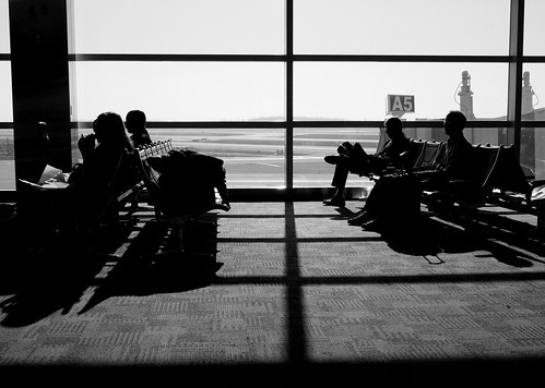 silhouette airport gate michigan detroit delta airline traveler