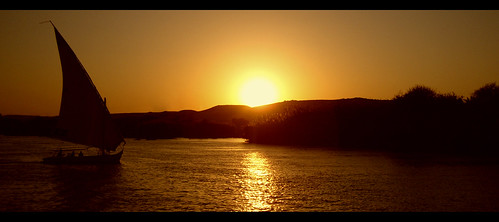sunset orange sun silhouette boat egypt nile felucca