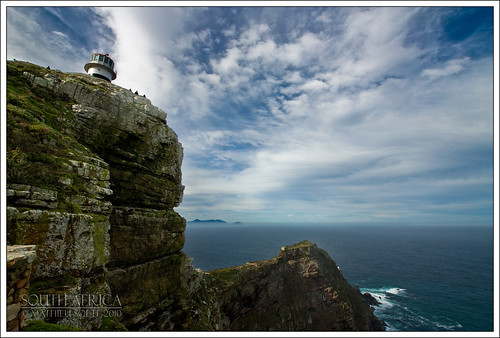 ocean africa sea sky lighthouse clouds southafrica rocks indianocean capepoint atlanticocean capeofgoodhope capepeninsula sigma1020mm suidafrika oldlighthouse thefairestcape andromeda50