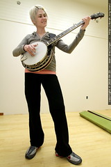 rachel playing banjo in the remodeled office 
