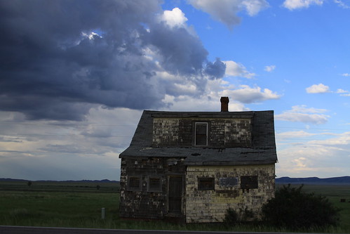 wood old sky house storm abandoned rotting grass yellow clouds condemned peeling paint alone decay empty shingles frame lonely wyoming prairie dilapidated ladscape bosler