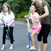 kelly helps her daughters pogo stick