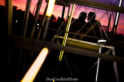 carnival sunset silhouette night lights photo engagement kiss ferriswheel bastropengagementphotography