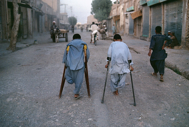 Young boys, victims of landmines, walk down the street in Herat, Afghanistan, 1992, by Steve McCurry