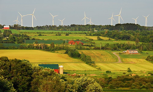 new york blue light summer sky sun ny green mill ecology windmill colors field yellow energy warm power unitedstates state wind top farm spin hill upstate ridge valley western land electricity blade lit bigtree setting eco turbine 20a strykersville varysburg