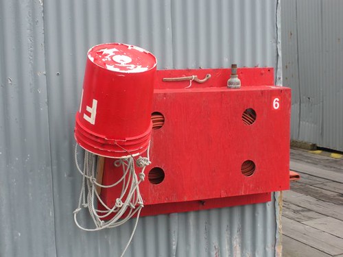 red metal alaska fire grey box kodiak cannery firebox salmonfishing kodiakisland icicleseafoods larsenbay fishprocessor