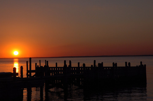 sunset sky orange sun black reflection beach water silhouette yellow bay newjersey dock shore jersey brantbeach
