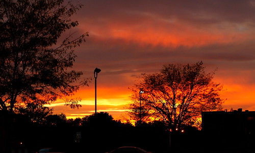 street trees sunset ohio red sky orange sun colors silhouette clouds high sundown north worthington