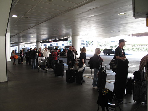 This is the taxi line at LAX; as you can see from the next photo some nitwit in airport administration has decided that only 6 taxis at a time can be in the line. The rest have to park blocks away.