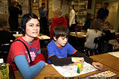 rachel sits with nick at his second grade desk 