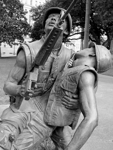 blackandwhite bw sculpture infantry bronze shoes war pants faces wounded knife expressions statues northcarolina raleigh nb equipment soldiers guns canteen grenade emotions figures bandage carry weapons memorialday colfax injured sculpt intheround vietnamveterans abbegodwin