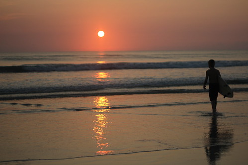 ocean morning boy usa sun water sunrise geotagged sand surf waves unitedstates florida atlantic surfboard daytonabeach daytonabeachshores geo:lat=2918998640 geo:lon=8098771920