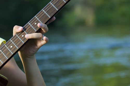 trees sunset portrait musician music woman playing love water girl beautiful beauty smile shirt female river relax person one model sitting guitar young romance teen sound instrument attractive teenager resting brunette relaxation talented acoustics