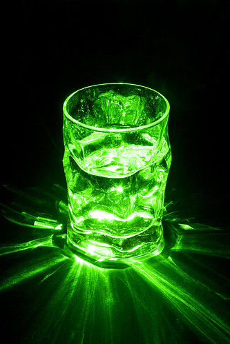 life light black reflection green water glass studio still long exposure pointer laser radioactive interference highly