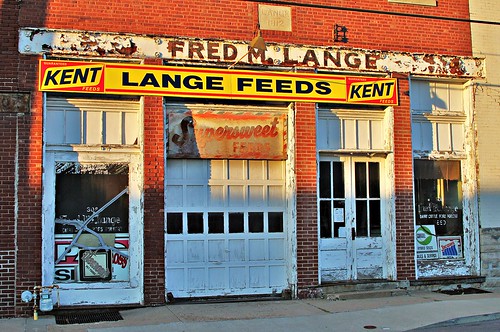 old building brick sign vintage store kent mainstreet peeling paint decay farming business age commercial missouri storefront feed 1912 roadside agriculture sedalia businessdistrict pettiscounty supersweet langefeeds fredmlange