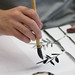 art student working in sumi-e, a traditional style of Japanese ink and wash painting