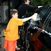 mother and son washing the car