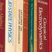 bindings of physics and mathematics books on shelf