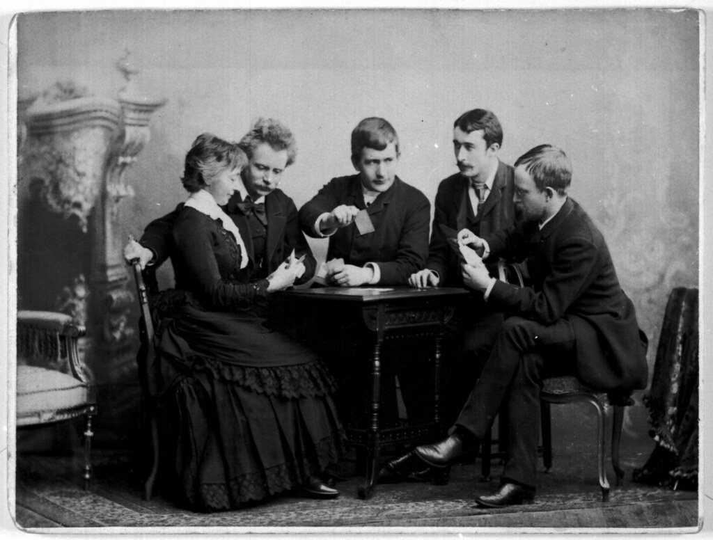 Edvard and Nina Grieg playing cards with three friends