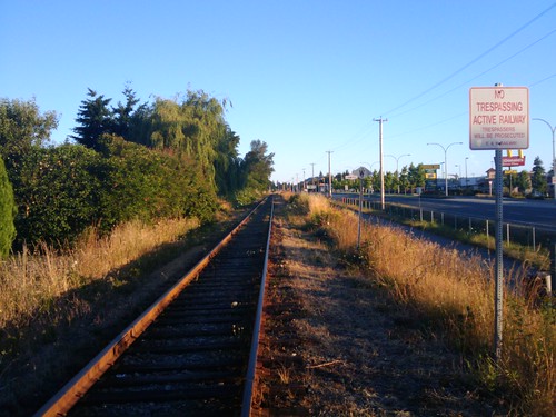 grass sign sunrise traintracks railway mcdonalds
