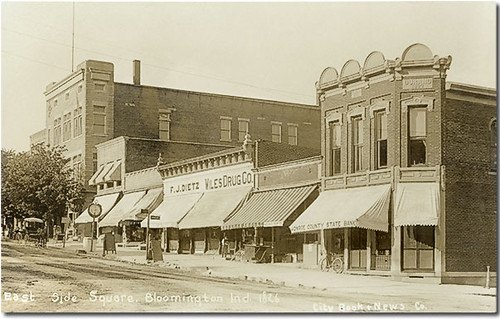horses people usa signs man men history sepia buildings advertising clothing indiana streetscene bicycles transportation drugs shops courthouse storefronts bloomington waterpump buggy dentist clocks buggies banks businesses realphoto hoosierrecollections